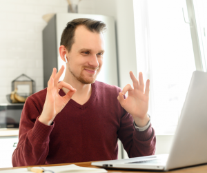 man with computer on video call