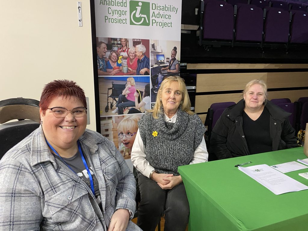 Amy, Pauline and Sarah sat at a table at the TVA volunteer fair